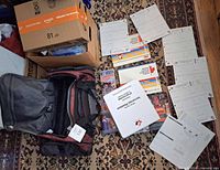 Top view of entire lot showing duffel, binders, books and forms