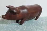 Full side view of carved ironwood pig