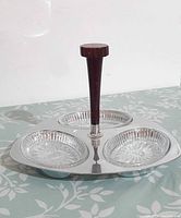 Top view of chrome tray with three glass dishes and bakelite handle