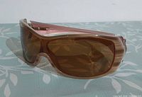 Front angled view of Oakley Riddle sunglasses showing frame colour and lens tint