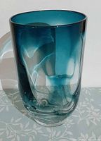 Front view showing turquoise to clear gradient and swirl