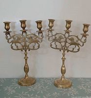 Pair of brass 3-arm candelabras front view