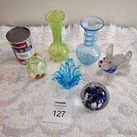 Group shot of all glass items with soup can for scale
