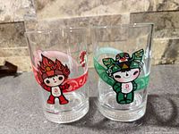 Both McDonalds Beijing 2008 Olympic mascot glasses side by side