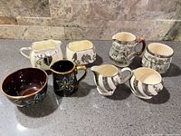 All eight cream and sugar pieces grouped