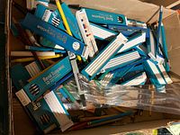 Top view of box showing Berol Turquoise lead packs, pencils and clear rulers