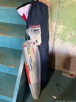 Chair and shelter components leaning against stair
