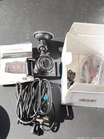 Dash camera, mount, manual, cables, box overview