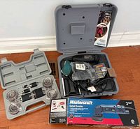 Overview showing detail sander in open case, ab wheel kit in second case and Mastercraft box