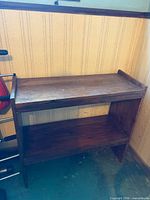 Front view of two-shelf wooden bookcase