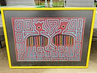 Front view of framed Kuna Mola textile art