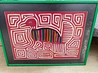 Front view of framed Kuna mola textile art