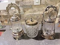 Three glass jars on counter showing full lot