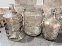 Three glass décor pieces side by side