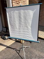 Front view of white projection surface on tripod stand