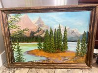 Full view of framed landscape painting