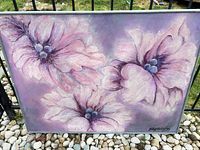 Full view of framed floral painting outdoors