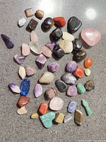 Overview of all polished gemstones laid out on countertop