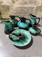 All six Blue Mountain Pottery pieces grouped to show forms and glaze