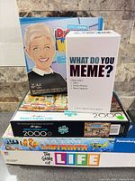 Stacked view of five boxed items showing fronts and titles