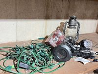 Pile showing all lights including string, projectors and lantern