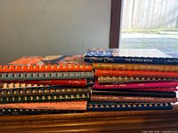 Stack of Company’s Coming cookbooks showing multiple spines and titles