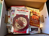 Top view of first box showing Great Desserts, Dining in Vancouver, Heritage Pot and other cookbooks