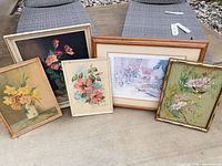 Group shot of all five framed prints lined up outdoors