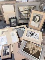Group view of entire lot showing variety of mounted photographs and framed portrait