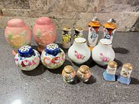 Front grouping of all six porcelain shaker pairs