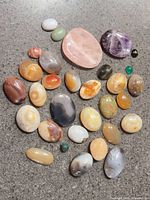 Group shot of all polished oval stones on countertop