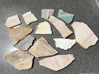 All thirteen stone slabs on countertop