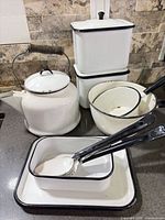Group shot of kettle, canisters, bowl, tray and utensils