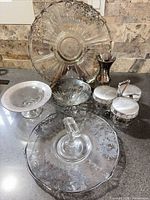 group shot showing all eight silver overlay glass pieces