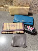 Group shot of all five wallets