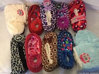 All 10 assorted slipper socks laid out
