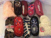 All ten slipper pairs laid out showing variety