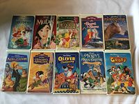 Front view of all 10 Disney VHS tapes in clamshell cases