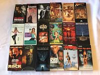 18 VHS tapes laid out showing front covers
