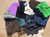 Pile of assorted men’s clothing laid flat