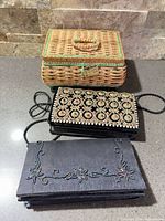 Overview of wicker sewing basket and two purses