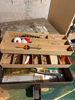 open tackle box showing tray and contents