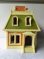 Front view showing porch, windows, roof