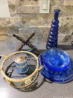 Entire lot showing plates, bowls, decanter, jar, basket and stand