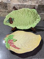 Overview of both Carlton Ware leaf plates showing shapes, colours and decorations