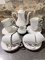 Full set: teapot, creamer, eight cups and saucers