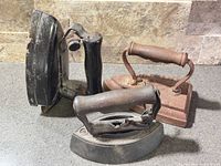 Group shot of all three cast iron irons