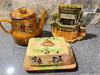 Group shot of teapot, McCoy planter and butter dish