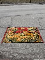 Full view of tapestry laid flat showing entire design and dimensions