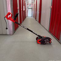 Full view of Black & Decker edger/trencher lying on floor